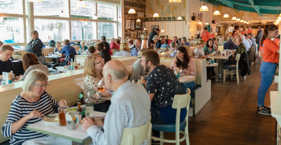 People dining inside Rockfish Plymouth restaurant